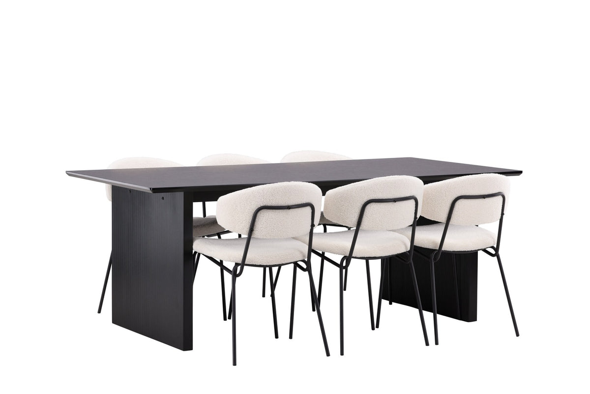 Esszimmerset aus rechteckigem MDF-Tisch in Rauchschwarz mit sechs Limhamn-Stühlen, beiger Samtbezug, muschelförmige Rückenlehne, schwarze Metallbeine.