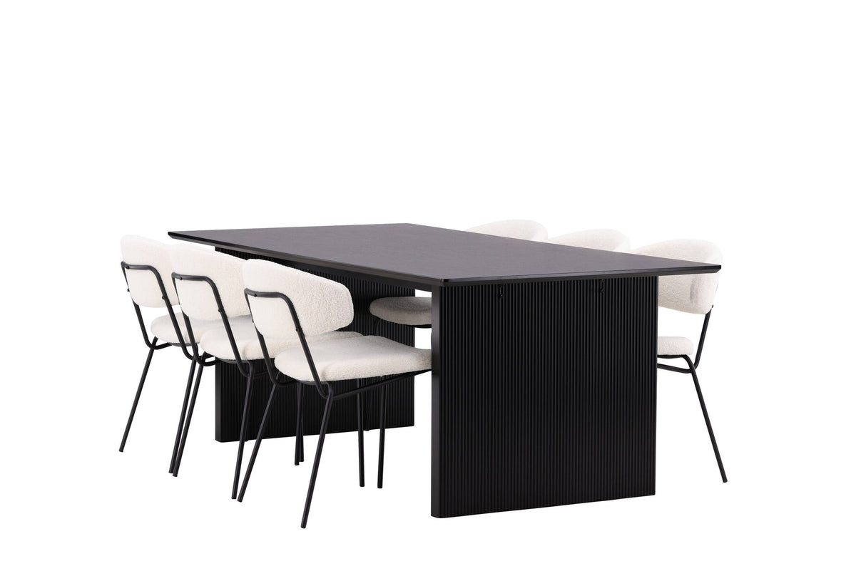 Esszimmerset aus rechteckigem MDF-Tisch in Rauchschwarz mit sechs Limhamn-Stühlen, beiger Samtbezug, muschelförmige Rückenlehne, schwarze Metallbeine.
