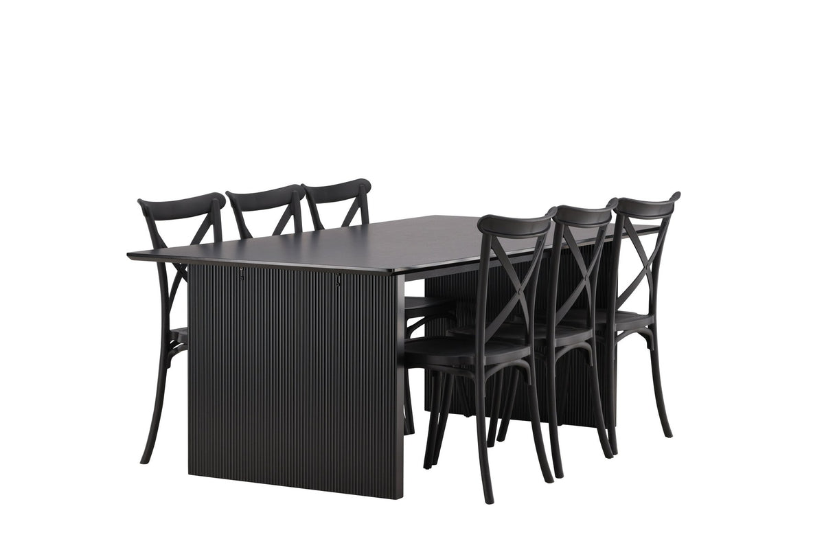 Esszimmerset aus rechteckigem MDF-Tisch in Rauchschwarz mit sechs Limhamn-Stühlen, beiger Samtbezug, muschelförmige Rückenlehne, schwarze Metallbeine.
