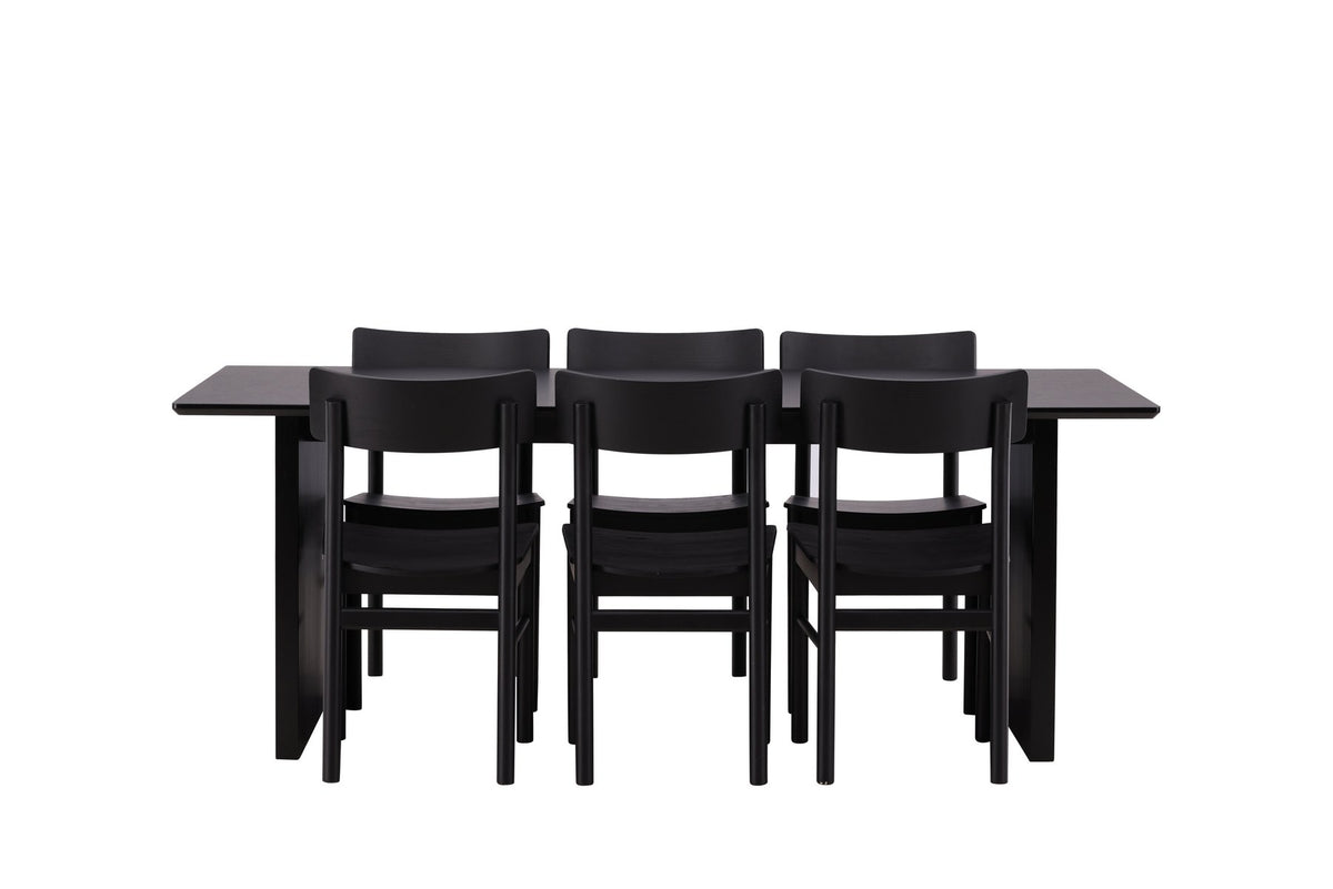 Esszimmerset aus rechteckigem MDF-Tisch in Rauchschwarz mit sechs Limhamn-Stühlen, beiger Samtbezug, muschelförmige Rückenlehne, schwarze Metallbeine.
