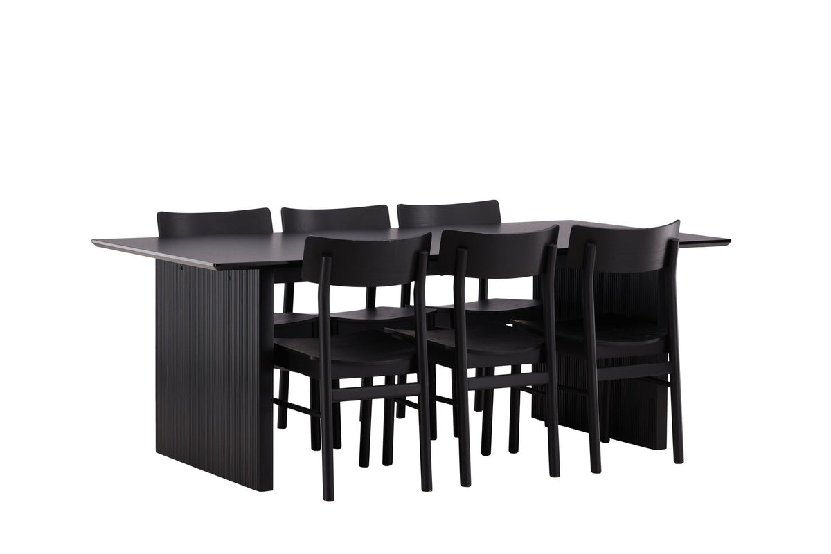 Esszimmerset aus rechteckigem MDF-Tisch in Rauchschwarz mit sechs Limhamn-Stühlen, beiger Samtbezug, muschelförmige Rückenlehne, schwarze Metallbeine.