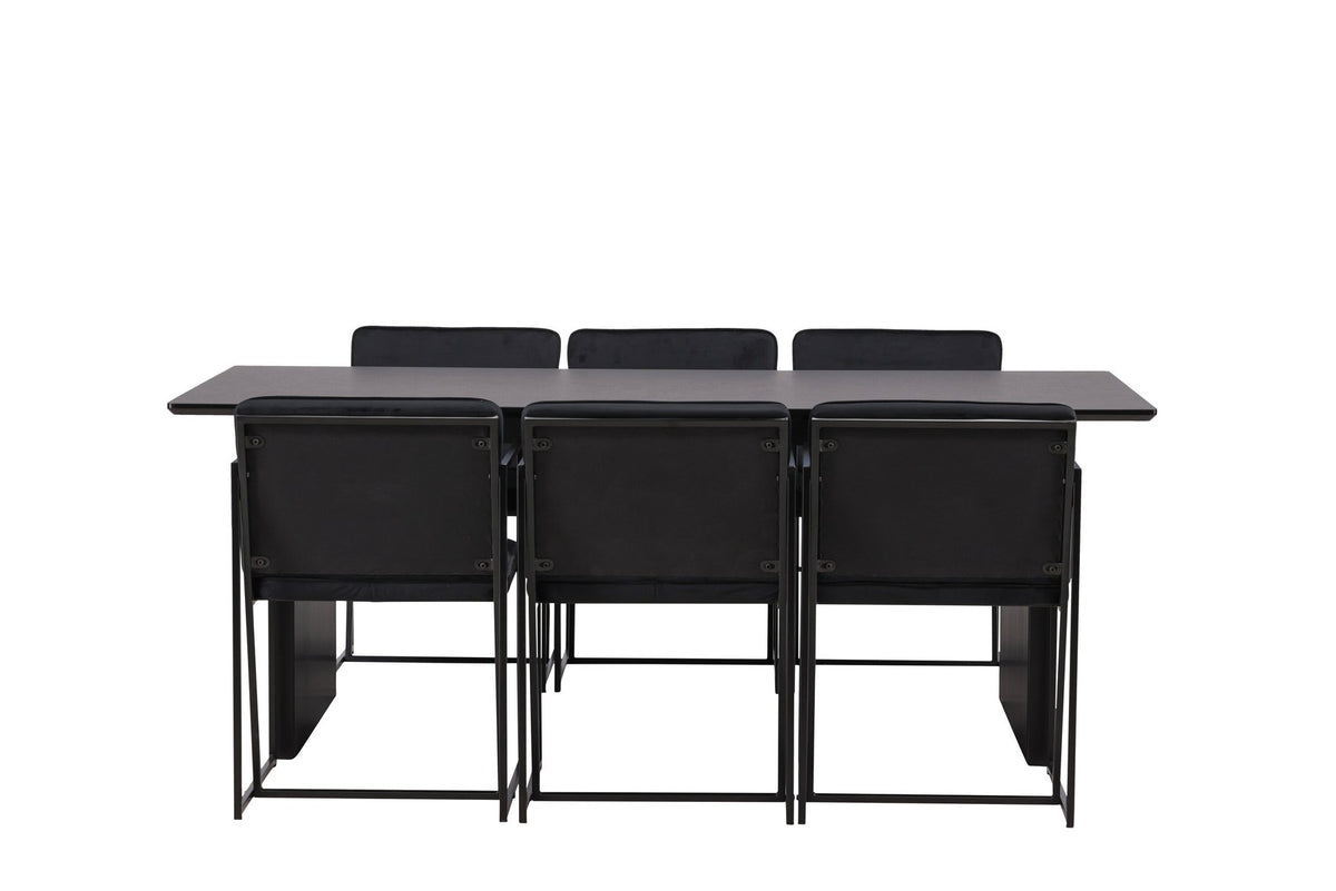Esszimmerset aus rechteckigem MDF-Tisch in Rauchschwarz mit sechs Limhamn-Stühlen, beiger Samtbezug, muschelförmige Rückenlehne, schwarze Metallbeine.