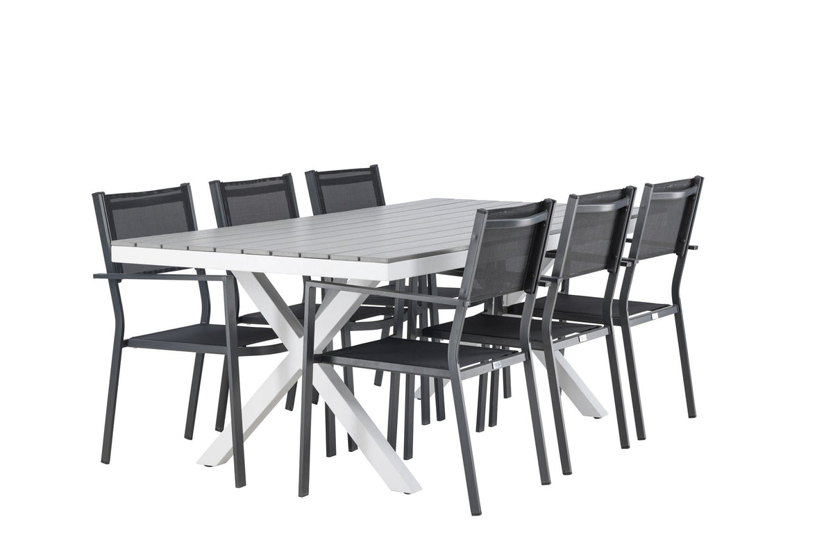Rechteckiger Gartentisch Garcia mit Aluminiumgestell und Aintwood-Platte, umgeben von sechs stapelbaren Copacabana-Stühlen mit Textilene-Sitzfläche.