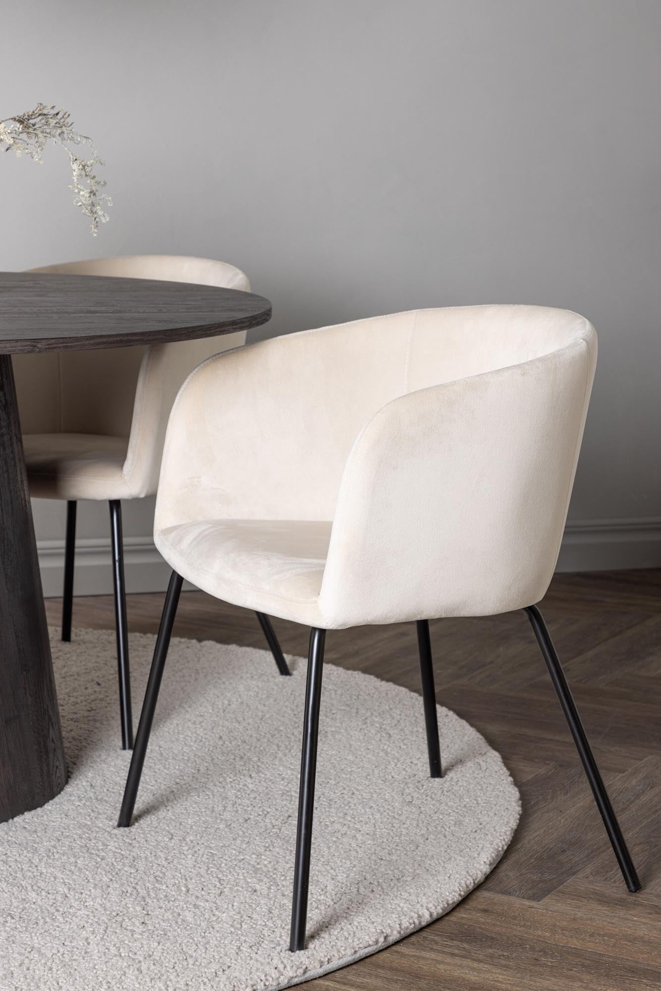 Elegantes Esszimmerset mit 120 cm runden Tisch aus braunem MDF und bequemen, gepolsterten Samtstühlen in Beige. Ideal für stilvolle Essbereiche.