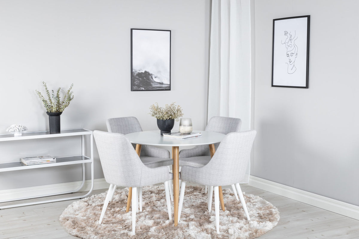 Esszimmer Set Plaza: heller Tisch mit weiss-grauer Oberfläche aus MDF und vier Stühle mit Stahlgestell, moderne Formensprache.