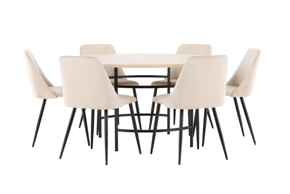 Rundes Esszimmerset Copenhagen mit Nachtstuhl von Venture Home: Tisch aus MDF in White Wash mit Metallgestell und sechs Samt-Stühlen mit schwarzen Beinen.