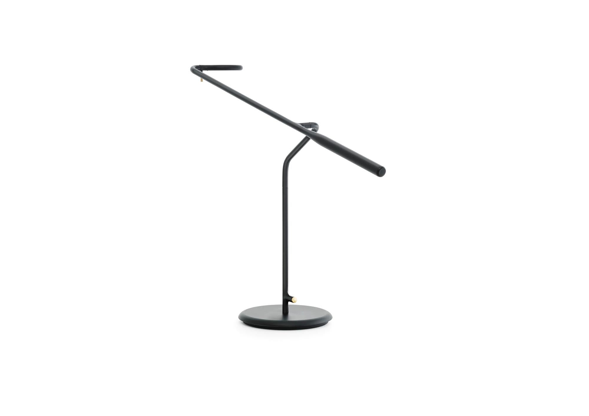 Die Flow Tischleuchte EU in Schwarz von Normann Copenhagen vereint modernes Design mit praktischer Funktionalität – ideal für jedes Zuhause.