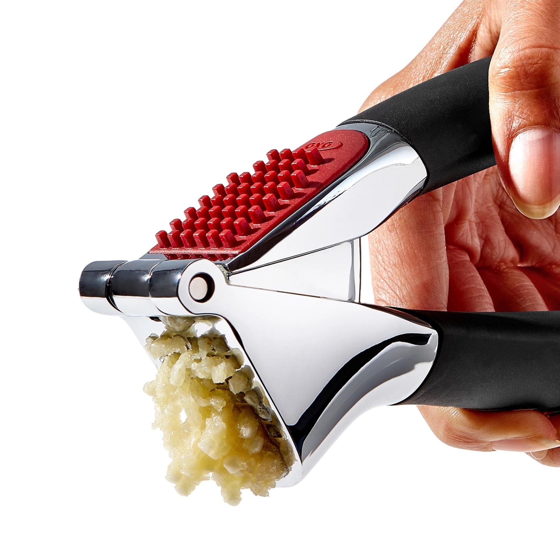 Moderne GG Knoblauchpresse in elegantem Schwarz mit integriertem Selbstreiniger, ideal für müheloses Zerkleinern von Knoblauch.