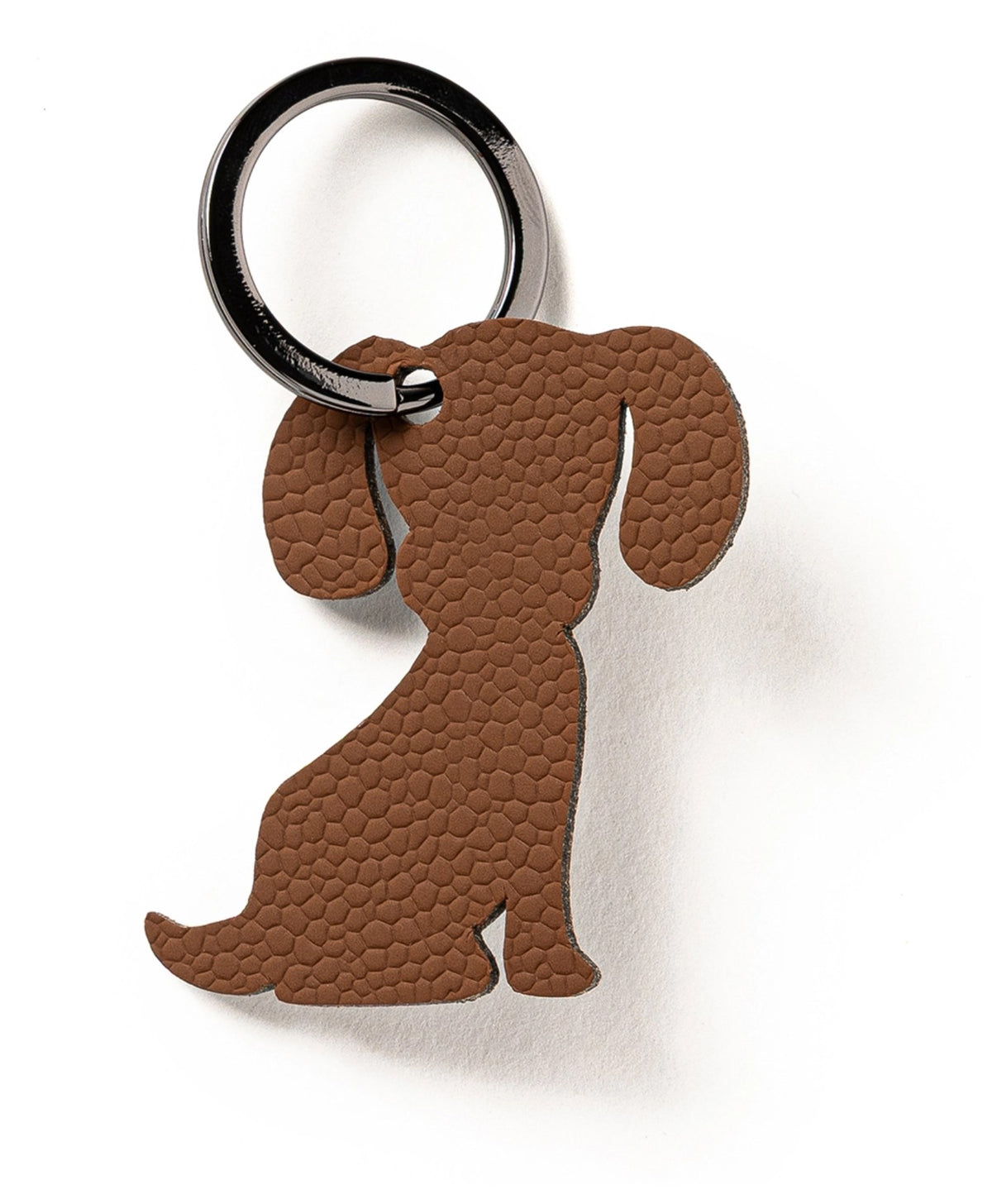 Kleiner Schlüsselanhänger in Hundeform, braun/cognacfarben, flaches Design, Masse 7 x 5 x 0.2 cm, Hersteller MiLLE W NORDISK DESIGN.