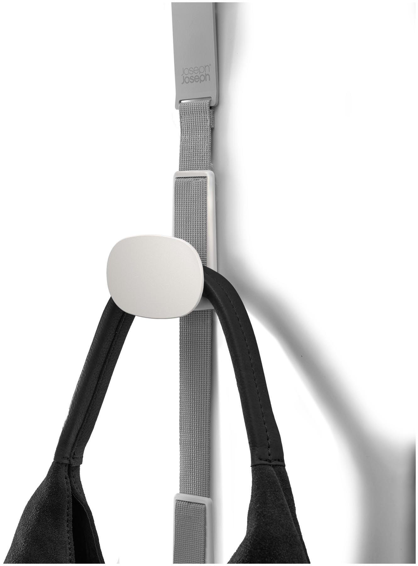Stylischer Taschenhalter in elegantem Ecru, ideal zur ordentlichen Aufbewahrung von Handtaschen und Alltagsgegenständen im Wohnbereich.