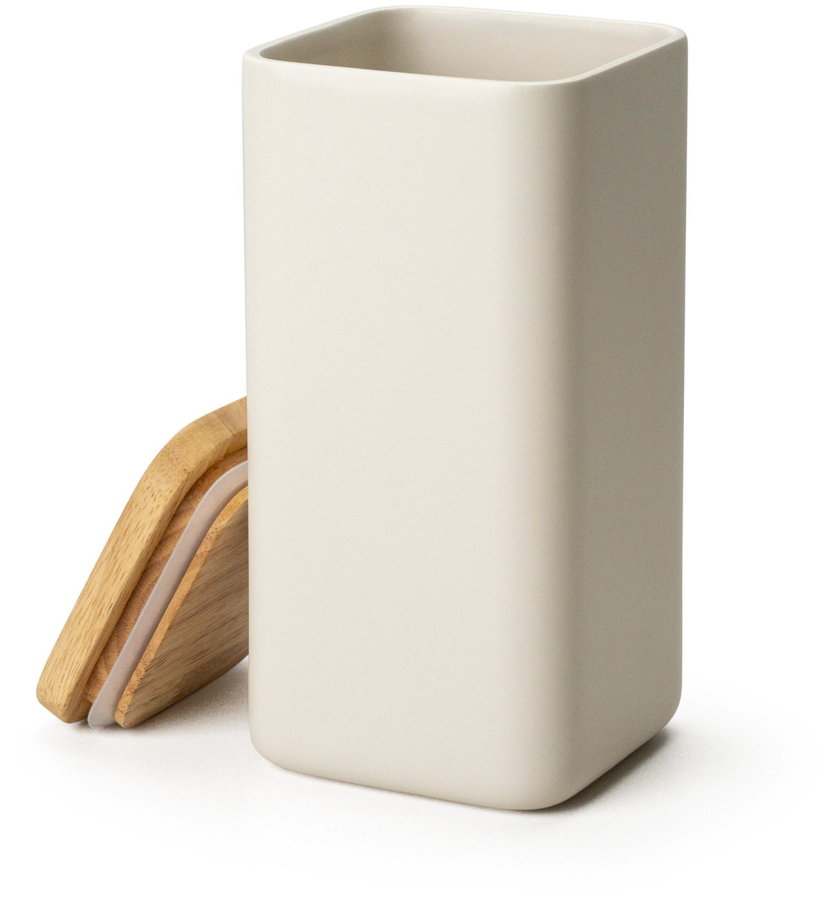 Beige Keramik Vorratsdose mit hellem Holzdeckel und Silikonring, quaderförmig mit abgerundeten Ecken, mattes Oberflächenfinish.