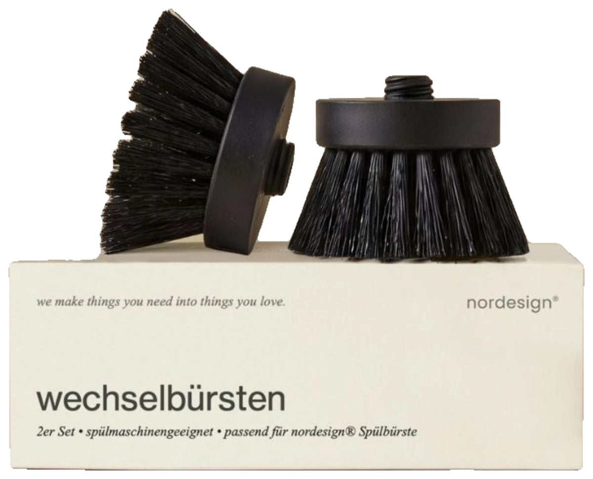 Zwei weisse Wechselbürstenköpfe aus Kunststoff von Nordesign mit dichten Borsten, passend für das magnetische Wechselsystem der Spülbürste.