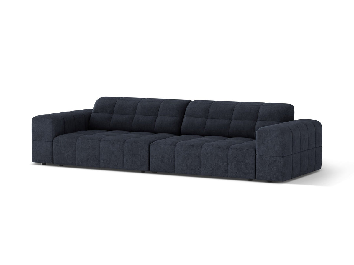 Beigefarbenes 4er Sofa Jennifer von Micadoni mit Samt-ähnlichem Bluvel-Stoff, schwarzen Kunststoffbeinen und gerader Rückenlehne.