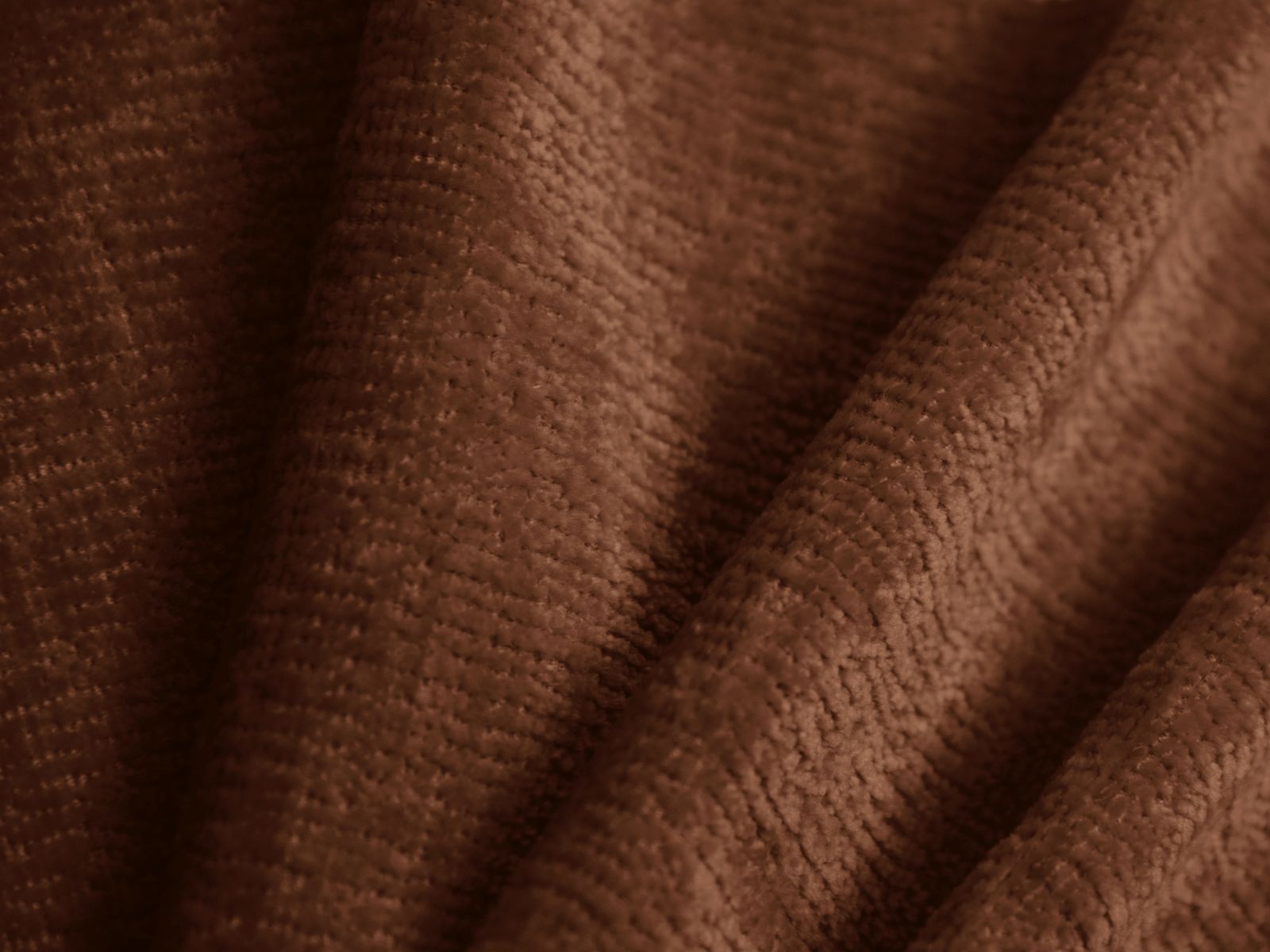 Modernes Ovalo Bett in warmem Terracotta, ideal für stilvolle Schlafzimmer, bietet zusätzlichen Stauraum und ein ansprechendes Kopfteil.
