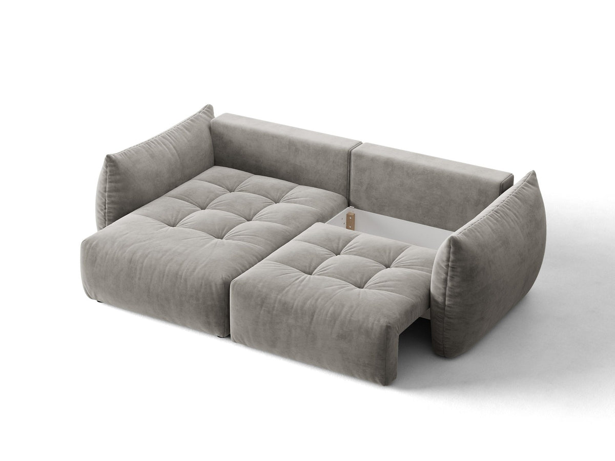 Ecksofa Bloom in Sand mit Velours-Bezug, schwarzen Kunststoffbeinen und ausklappbarer Schlaffunktion samt Bettkasten unter der Sitzfläche.