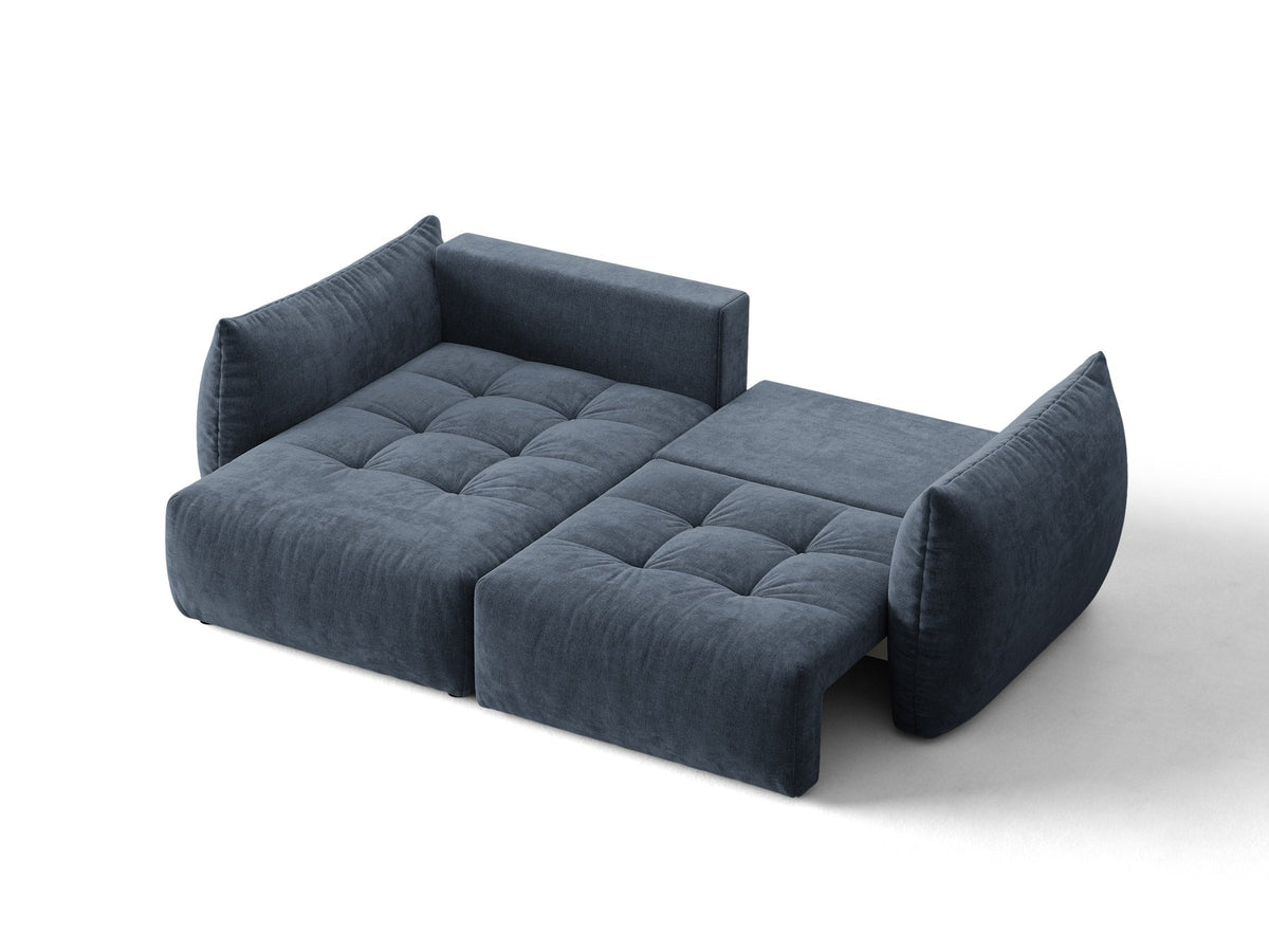Ecksofa Bloom in Sand mit Velours-Bezug, schwarzen Kunststoffbeinen und ausklappbarer Schlaffunktion samt Bettkasten unter der Sitzfläche.