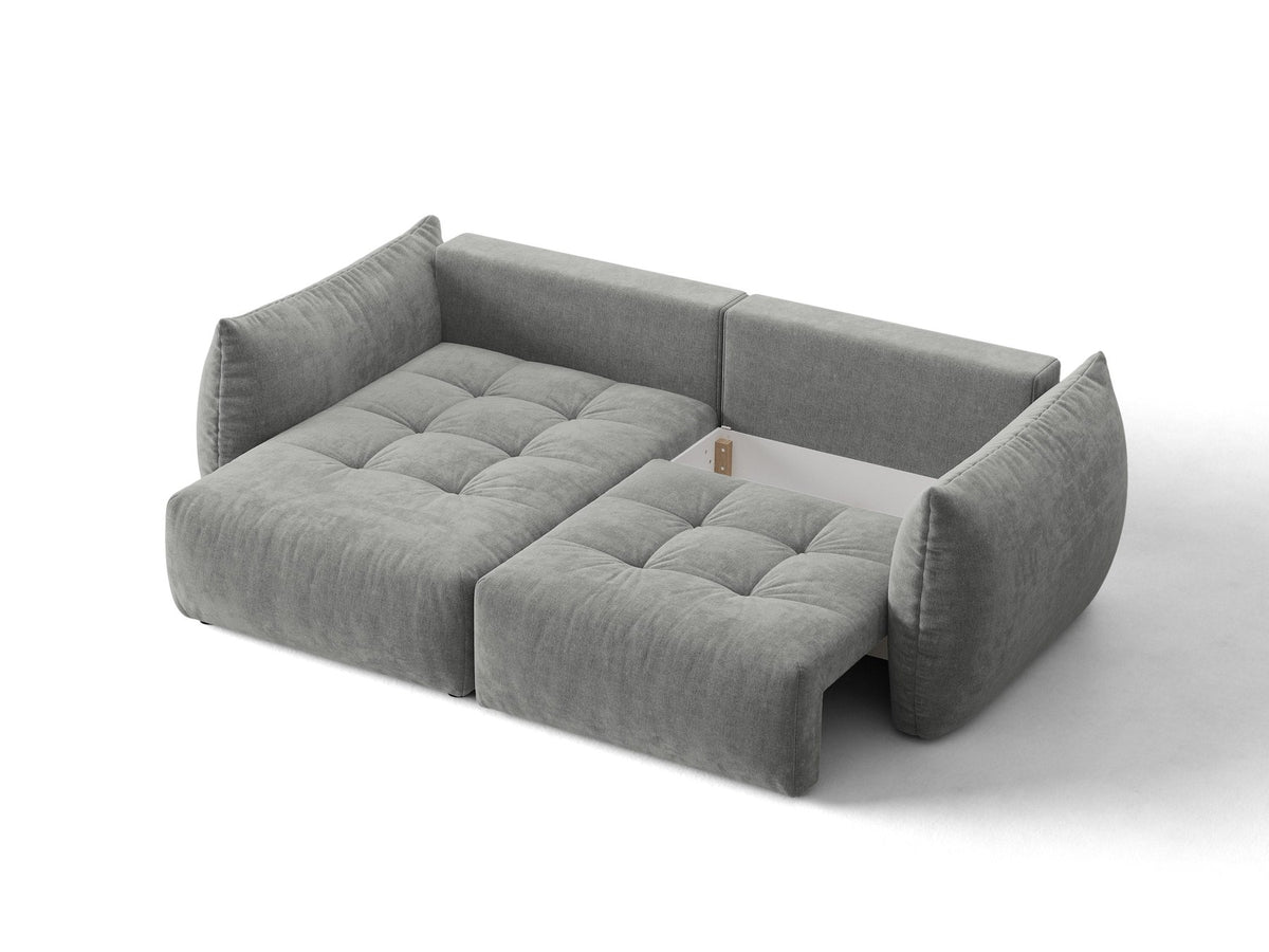 Ecksofa Bloom in Sand mit Velours-Bezug, schwarzen Kunststoffbeinen und ausklappbarer Schlaffunktion samt Bettkasten unter der Sitzfläche.