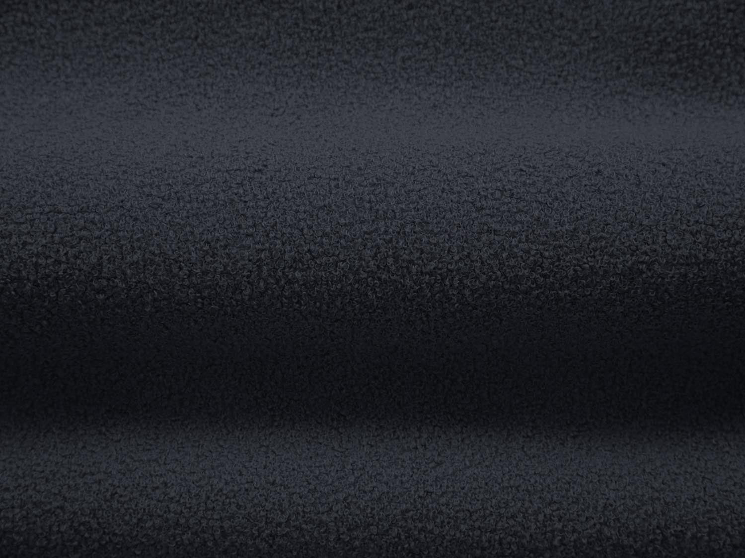 Stylischer Jenny Boucle Pouf in tiefem Blau, vielseitig einsetzbar als Sitz oder Ablage, verleiht jedem Raum einen modernen Touch.