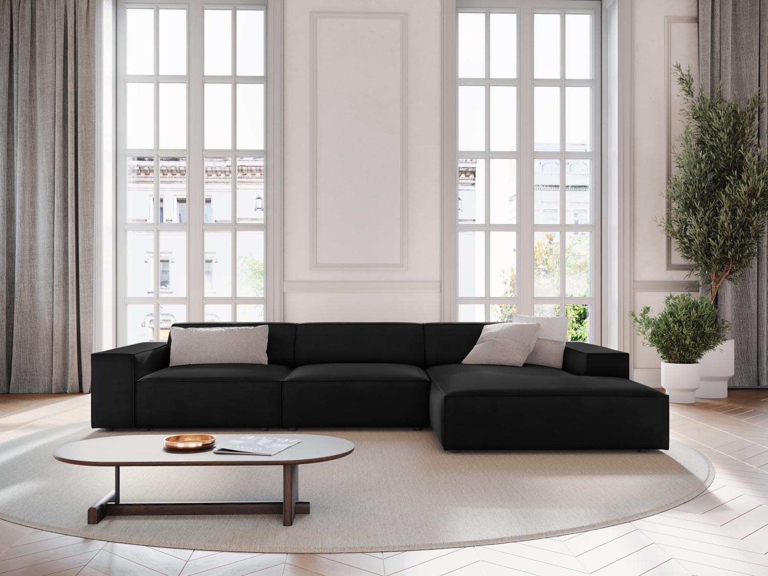 Elegantes Jodie Velour Ecksofa in Schwarz-Bluvel, modulares Design, ideal für stilvolle Wohnräume, präsentiert in einer einladenden Atmosphäre.