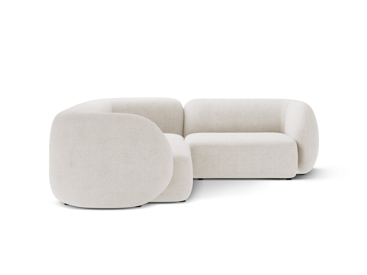 Weisses Ecksofa rechts von Micadoni aus der Kate-Serie mit strukturiertem Bouclé-Stoff, schwarzen Kunststoffbeinen und modularem Aufbau.