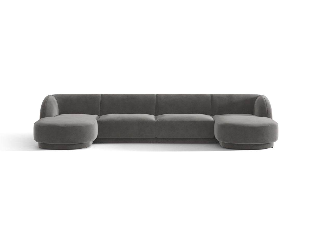 Dunkelbeiges Panorama-Ecksofa Miley von Micadoni mit Bluvel-Stoffbezug, L-Form, schwarzen Kunststoffbeinen und niedriger Rückenlehne.