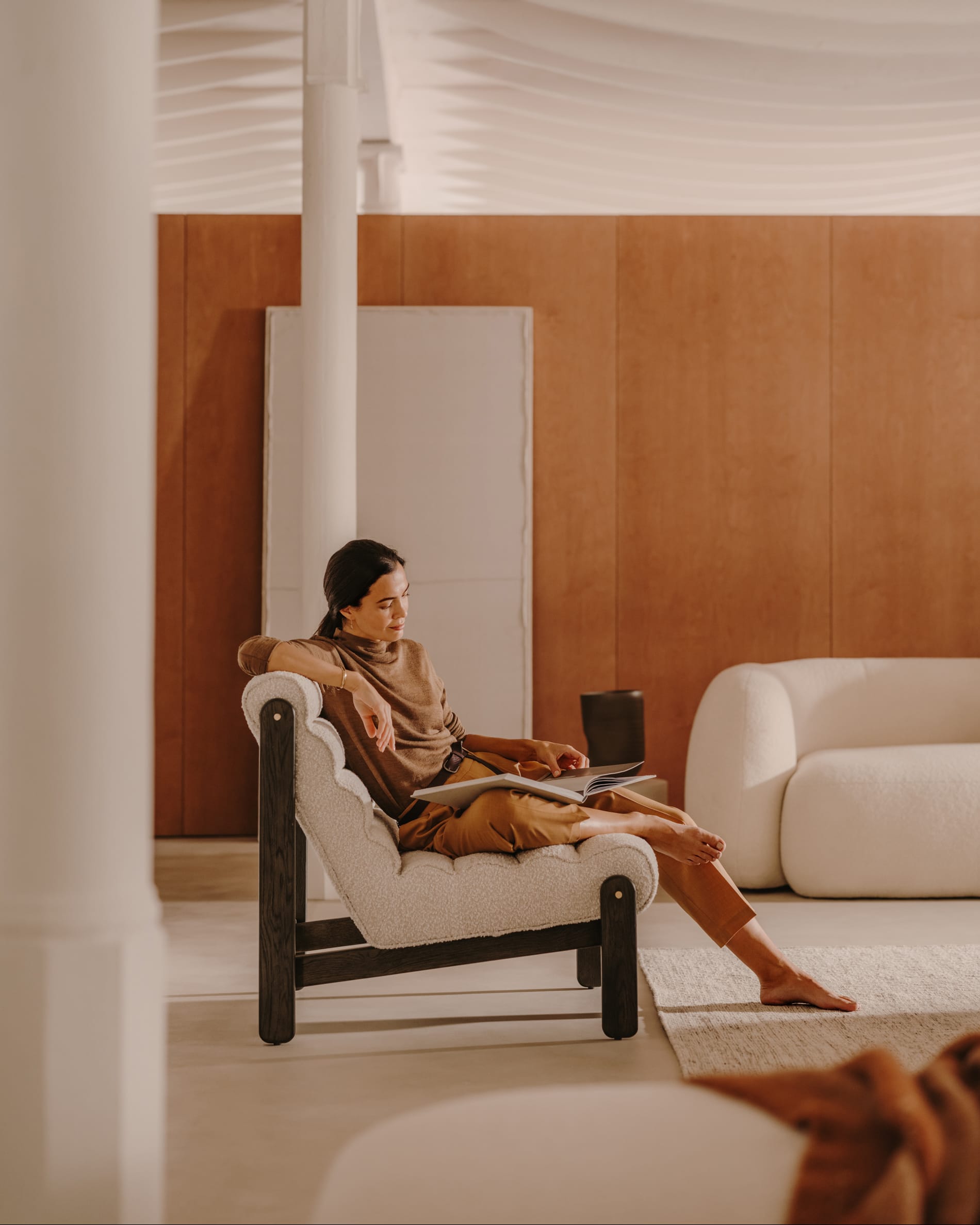 Magira armchair in <tc>wEIS</tc> bouclé and solid oak with dark finish