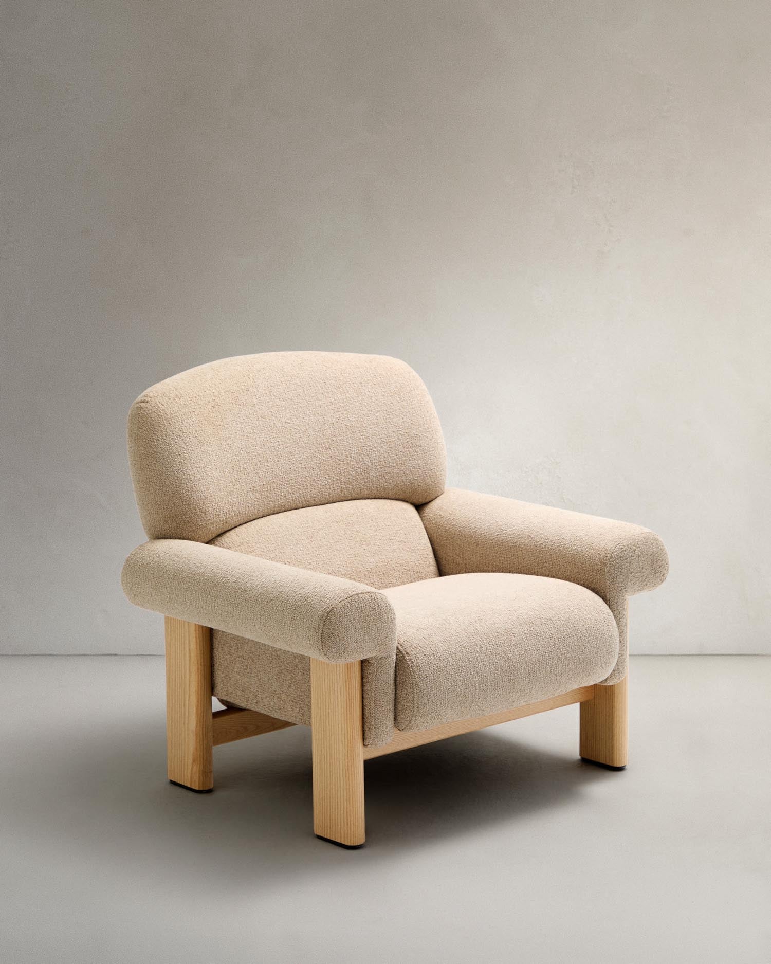 Armchair nema made of beige chenille and legs made of solid ash wood with natural