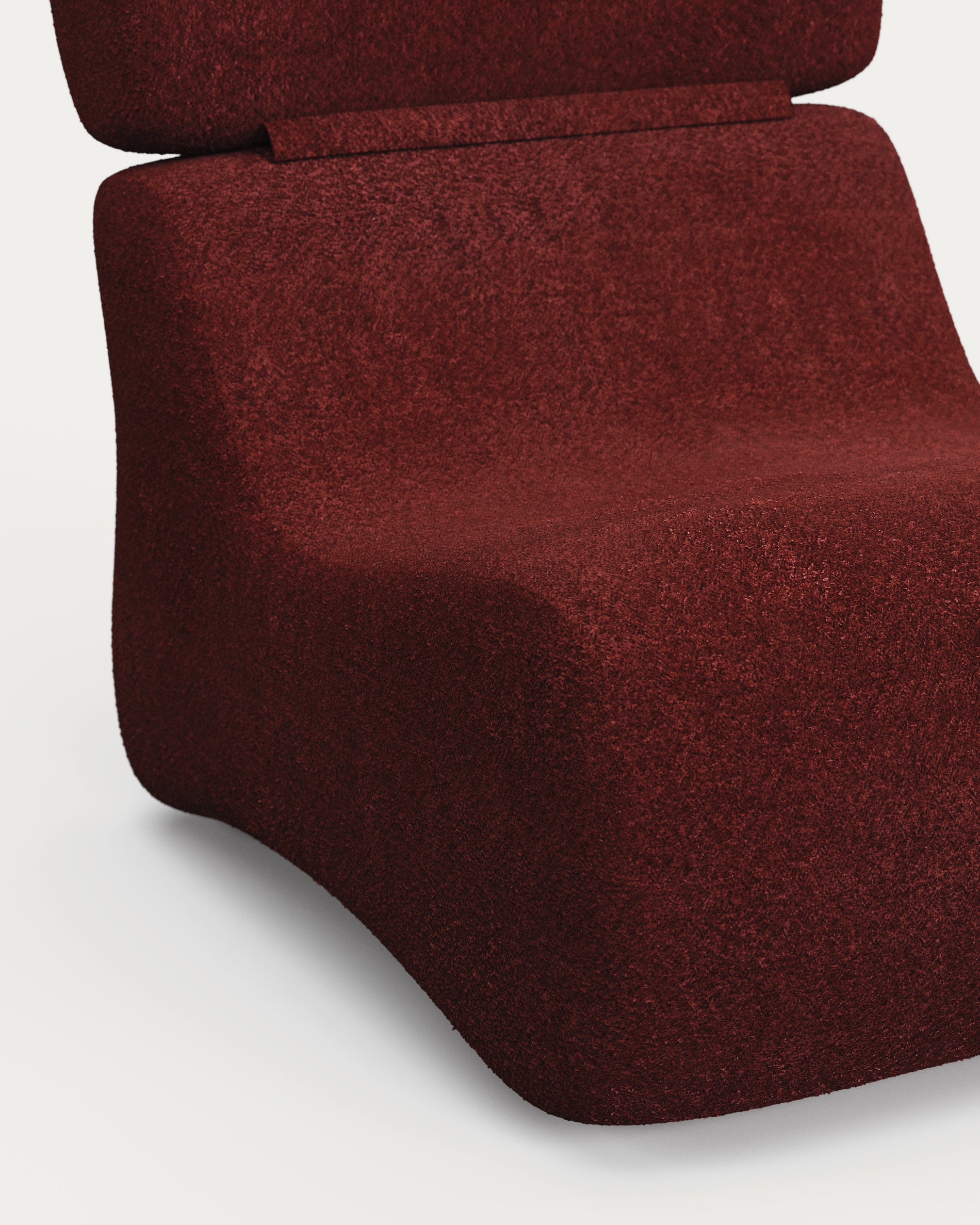 Eleganter Club-Sessel in luxuriösem Bordeaux-Bouclé, ideal für gemütliche Abende und stilvolle Wohnräume.