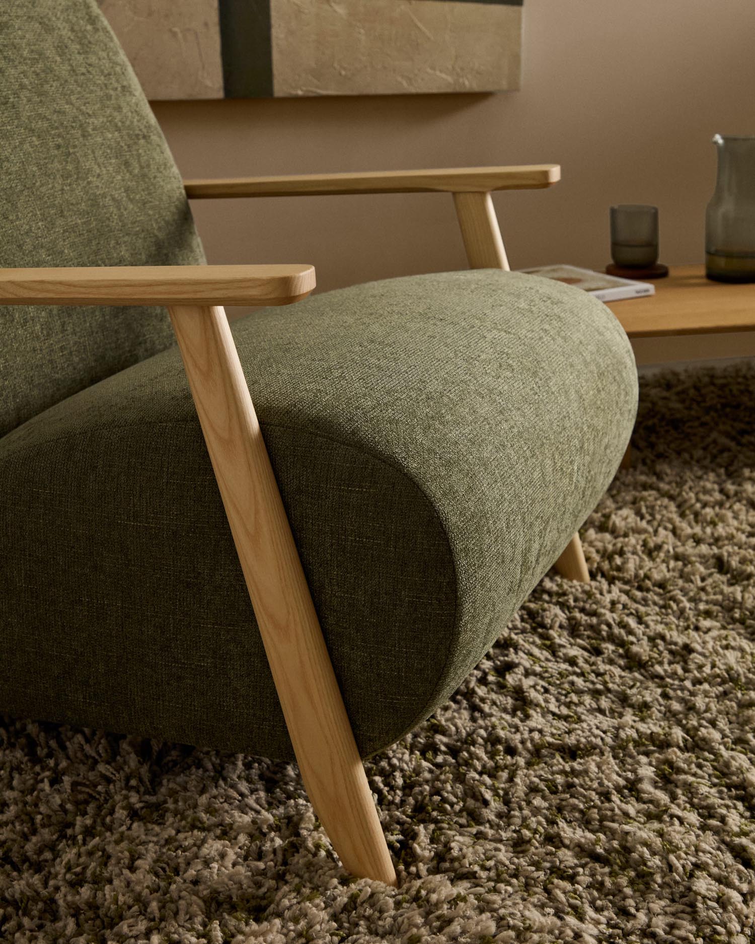 Armchair Meghan made of green chenille and solid ash wood with natural finish FSC Mix C