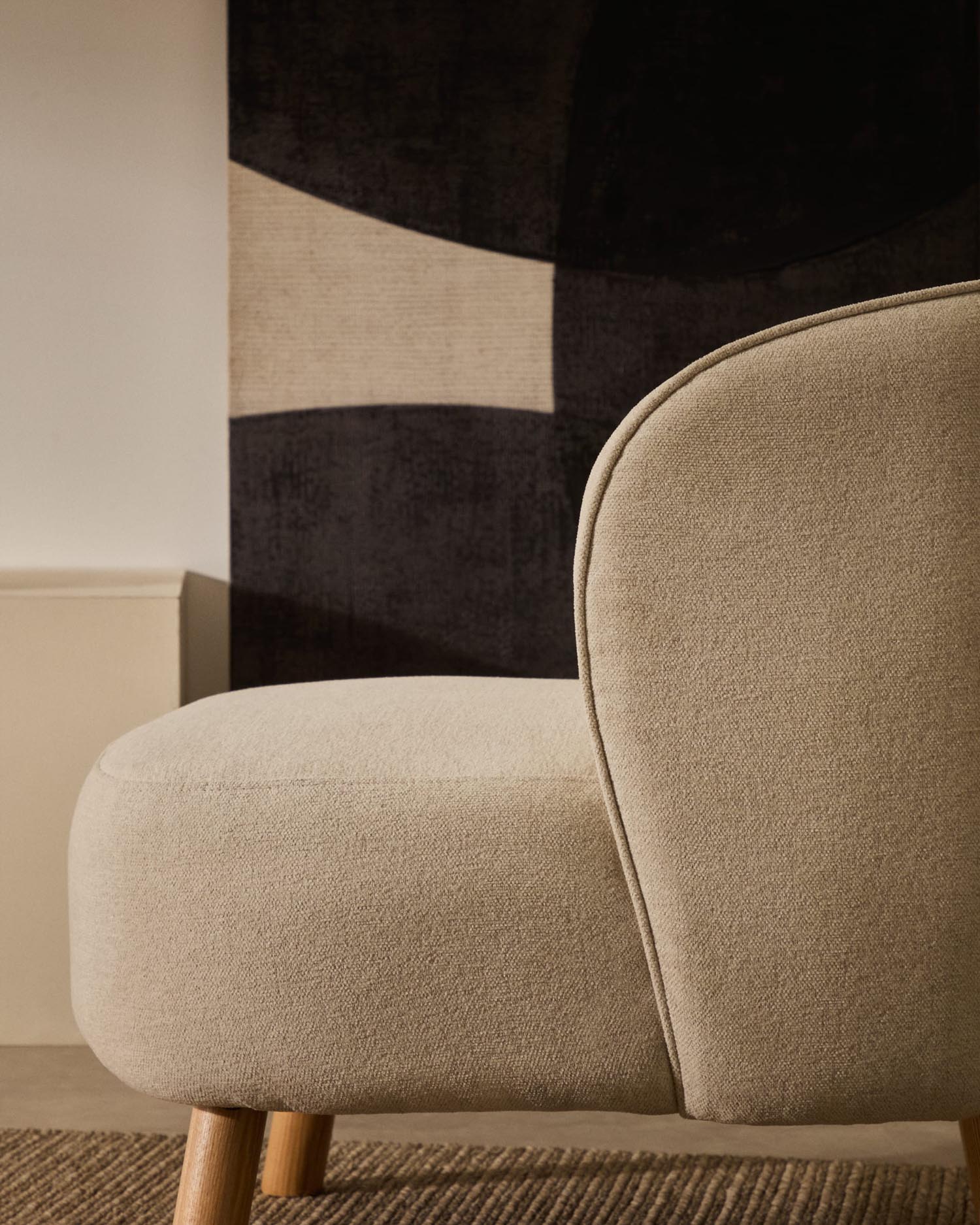 Armchair from beveled chenille and legs made of solid beech wood with natural