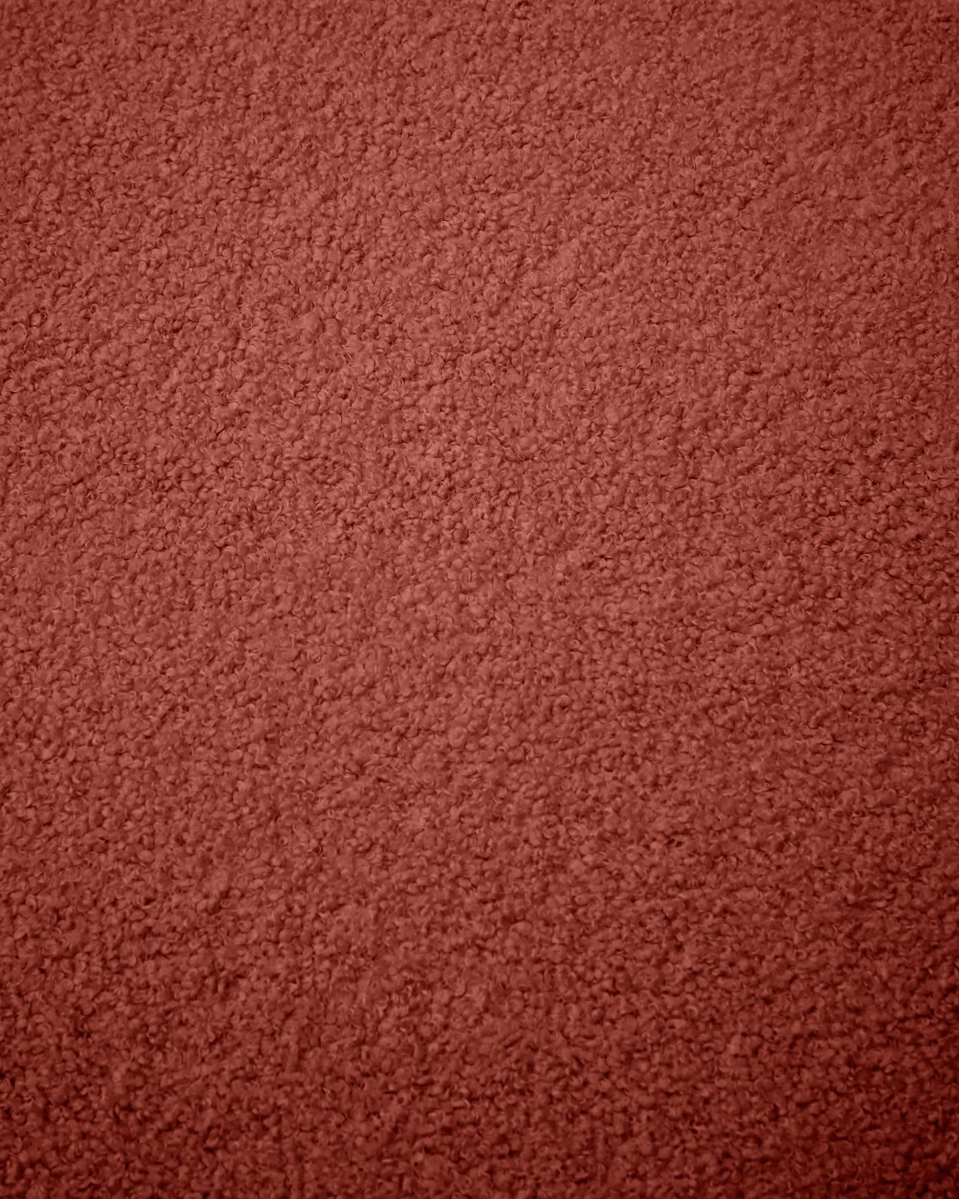 Terrakottafarbener Bouclé-Bezug für den Kaeli-Fusshocker, Ø 60 cm, von Kave Home. Stilvoll und bequem für Ihr Zuhause.