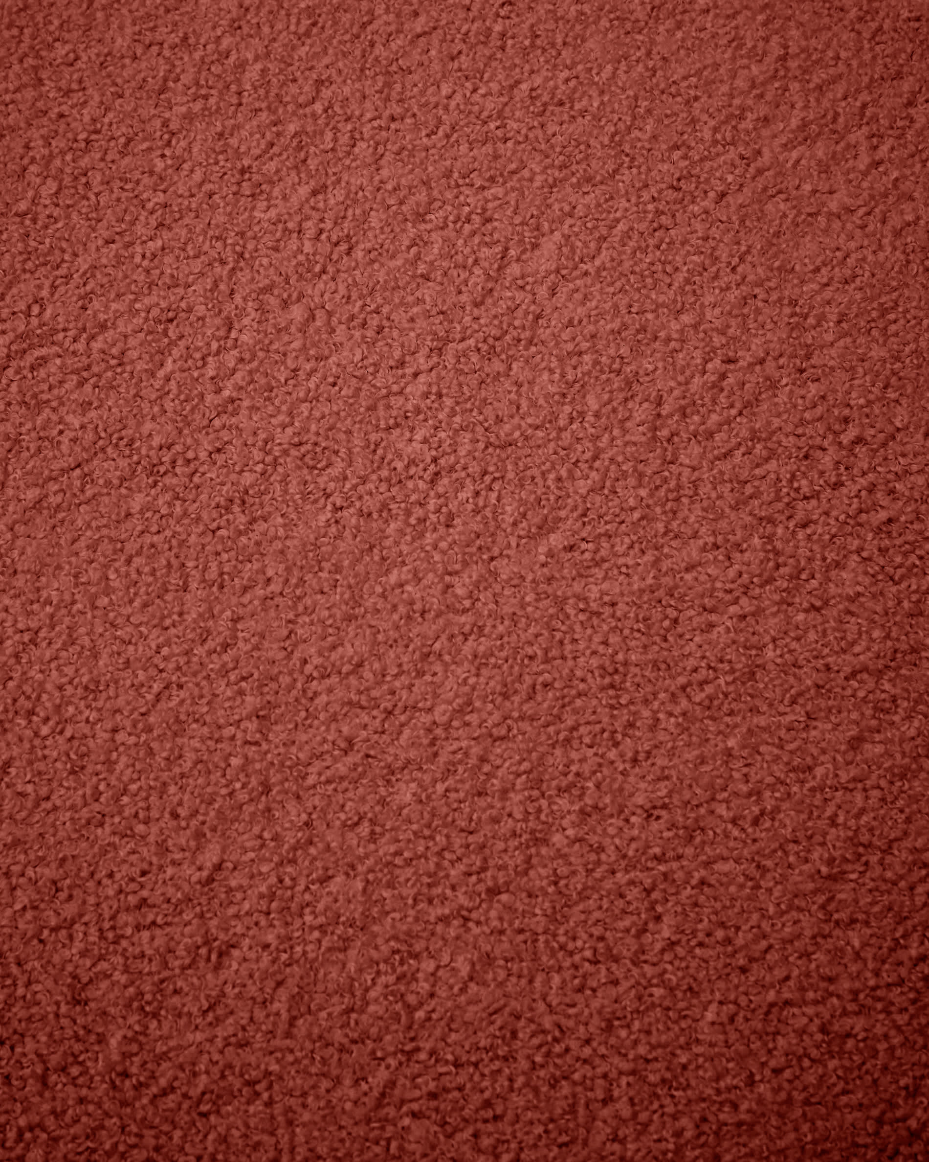 Terrakottafarbener Bouclé-Bezug für den Kaeli-Fusshocker, Ø 60 cm, von Kave Home. Stilvoll und bequem für Ihr Zuhause.
