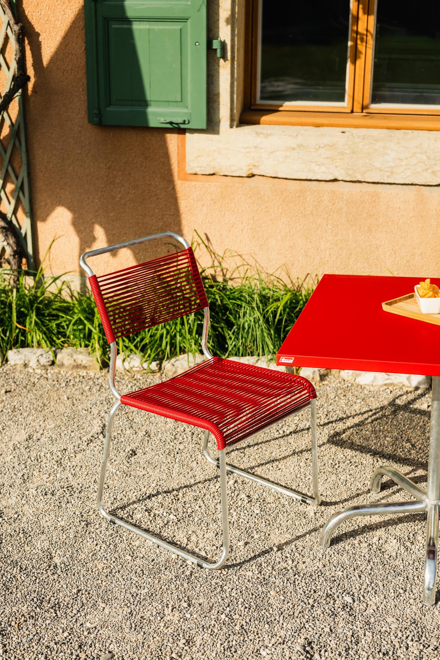 Spaghettistuhl Säntis mit Kufen in Rot präsentiert im Onlineshop von KAQTU Design AG. Gartenstuhl ist von Schaffner