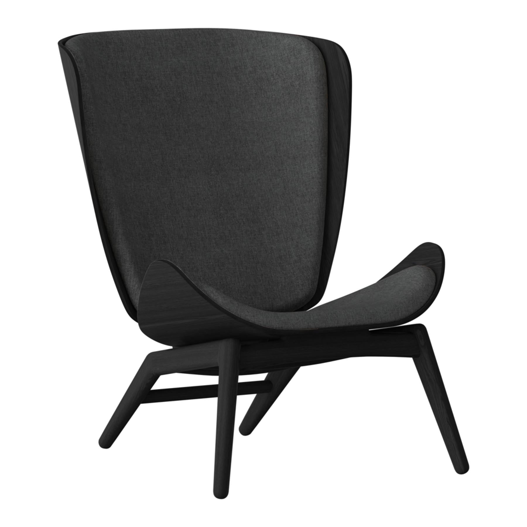 Eleganter Reader Sessel von Umage, ideal für gemütliche Leseecken. Hochwertige Materialien und zeitgemäße Ästhetik vereinen Komfort und Stil.
