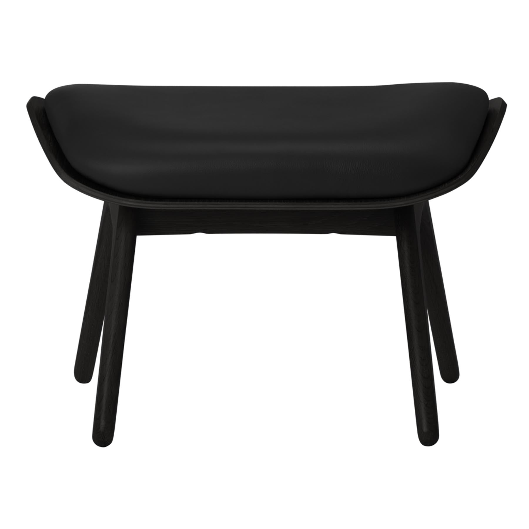 Eleganter schwarzer Ottoman von Umage, ideal für stilvolle Wohnräume und gemütliche Leseecken, bietet sowohl Komfort als auch modernes Design.