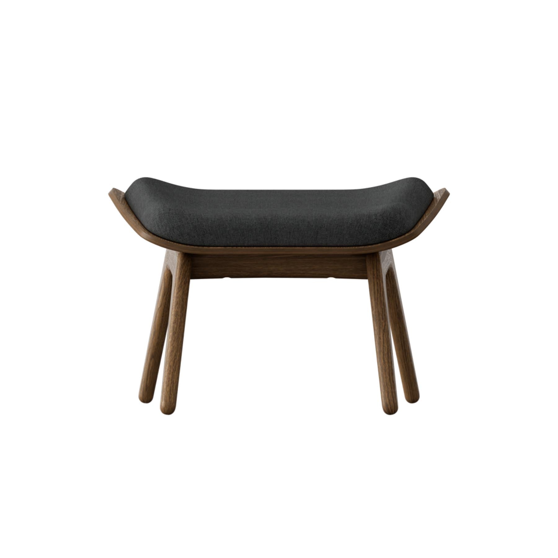 Eleganter Reader Ottoman in Shadow von Umage, ideal für gemütliche Leseecken und stilvolle Wohnräume.