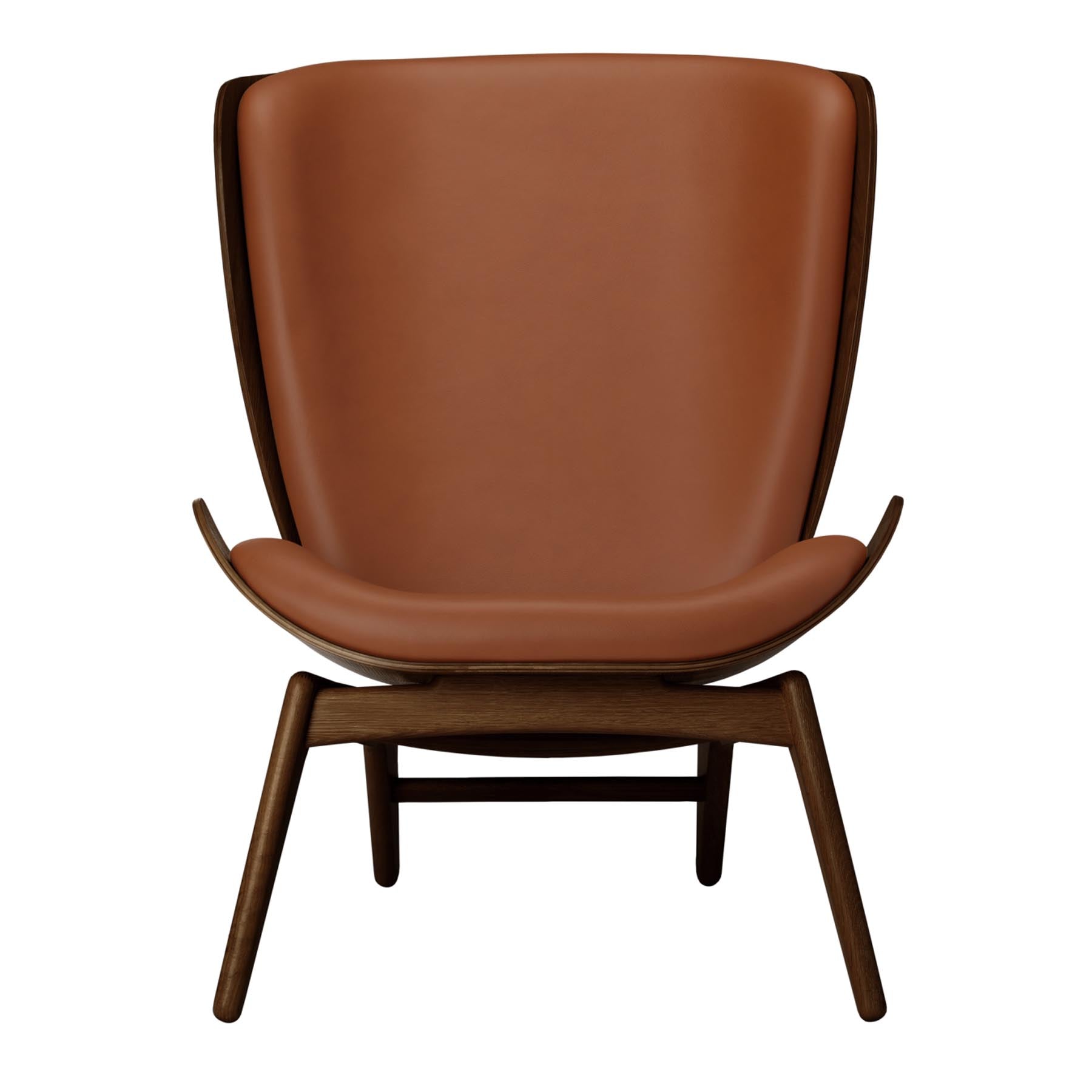 Eleganter Reader Sessel in warmem Cognac, ideal für stilvolle Wohnräume. Hochwertiges Design von Umage für Komfort und Ästhetik.