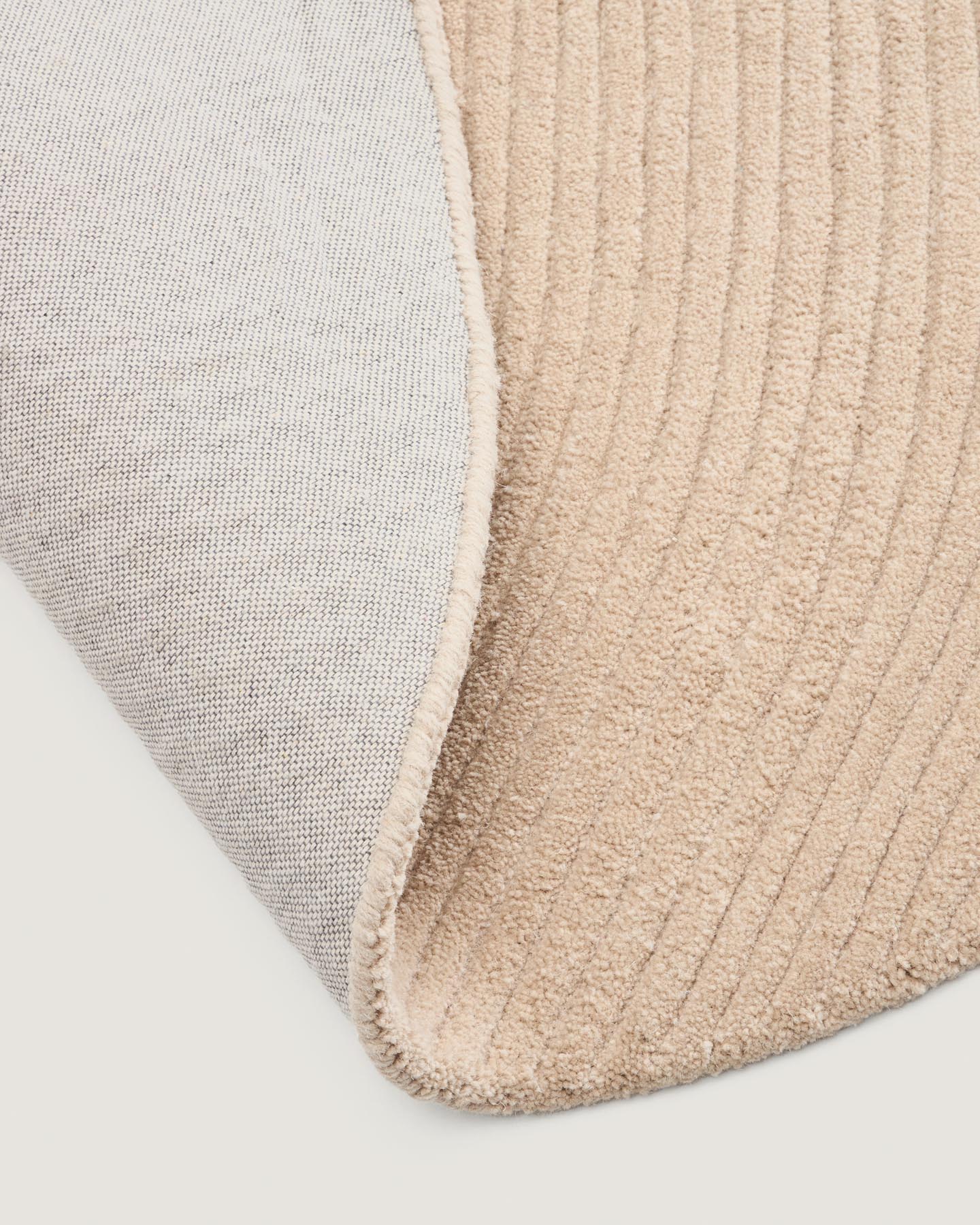 Teppich Domm aus Wolle beige Ø 200 cm in Ecru präsentiert im Onlineshop von KAQTU Design AG. Teppich ist von Kave Home