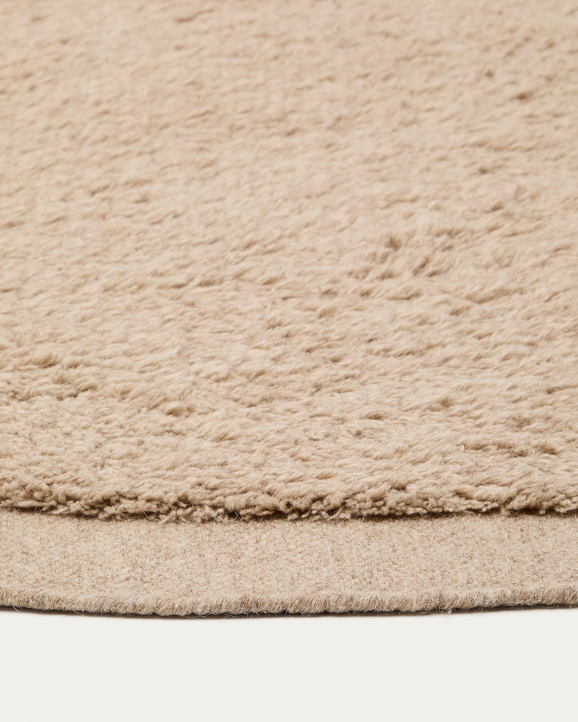 Runder Teppich Marely aus Wolle in Beige, Ø 200 cm, von Kave Home. Stilvoll, hochwertig und perfekt für jedes Zuhause.