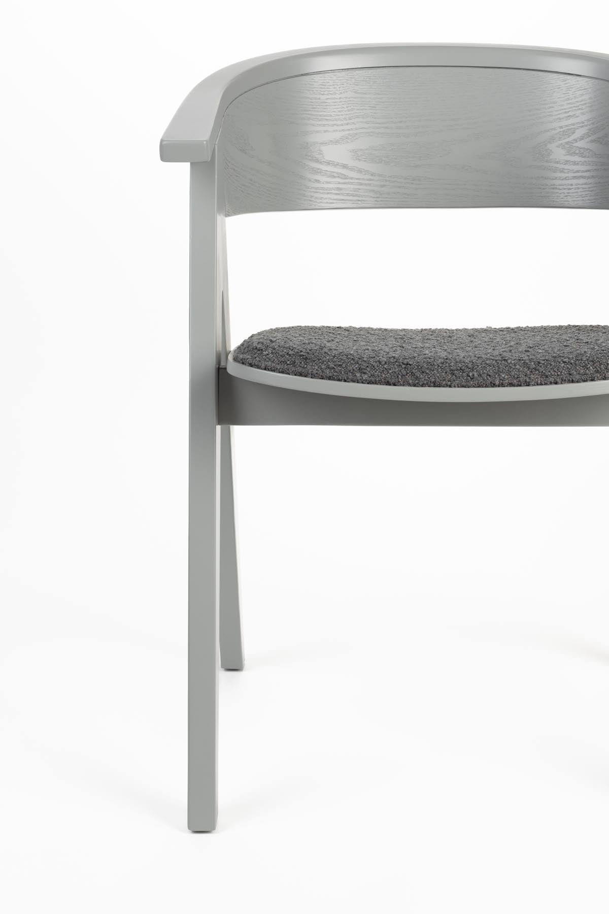 Stuhl Ndsm in Grau präsentiert im Onlineshop von KAQTU Design AG. Schalenstuhl mit Armlehne ist von Zuiver